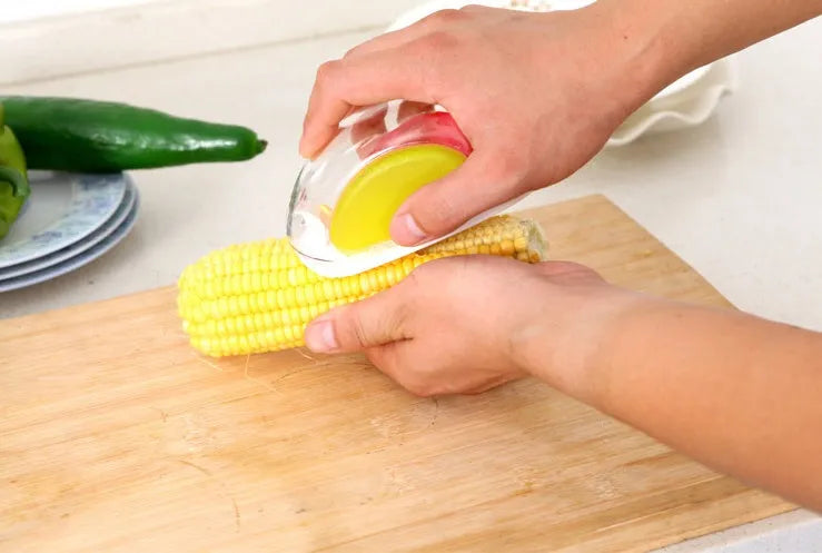 Corn stripper kitchen tool with stainless steel wavy blade and plastic handle for removing kernels from cobs