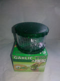 Green transparent PP plastic garlic peeler kitchen gadget with dimensions 8.5x8.5x6cm