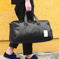 Black waterproof sports fitness bag with separate shoe compartment and diagonal strap.