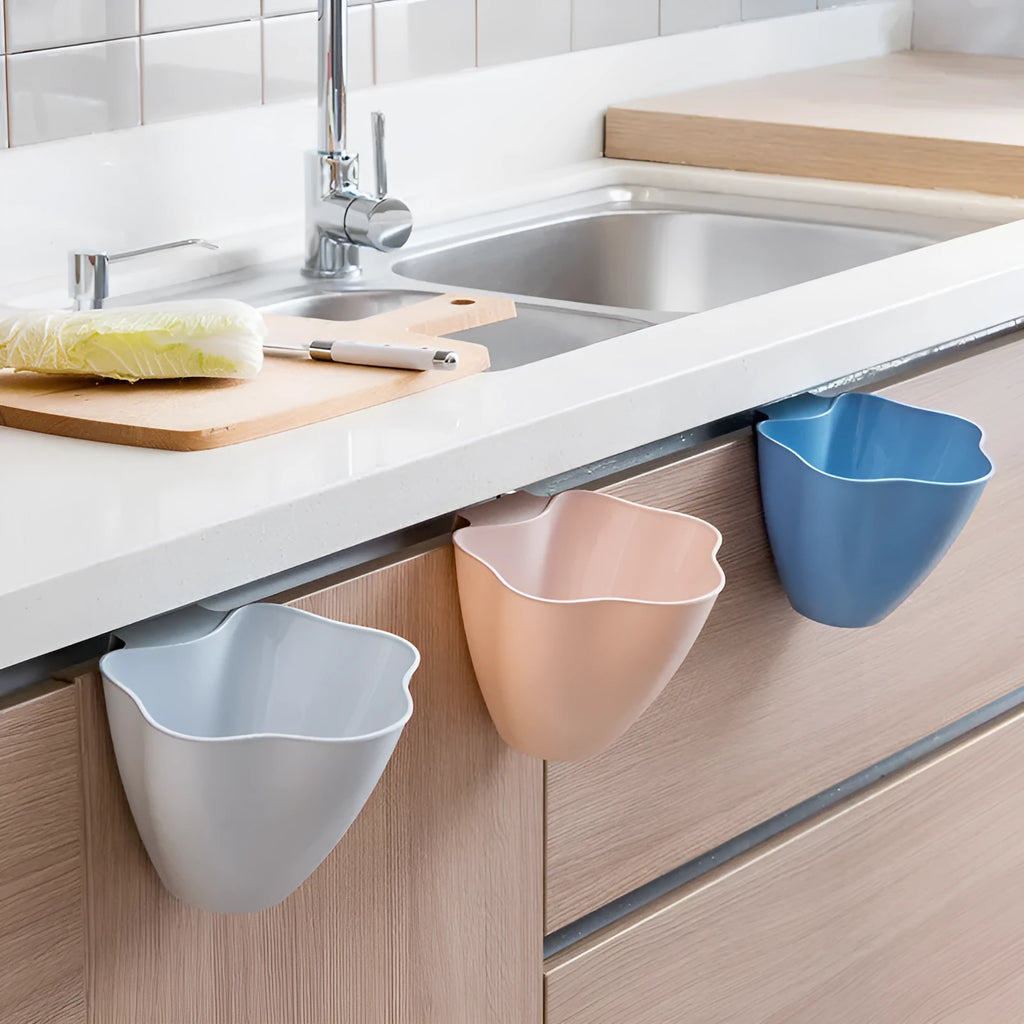 A slim Nordic blue plastic rubbish bin designed for kitchen cabinets.