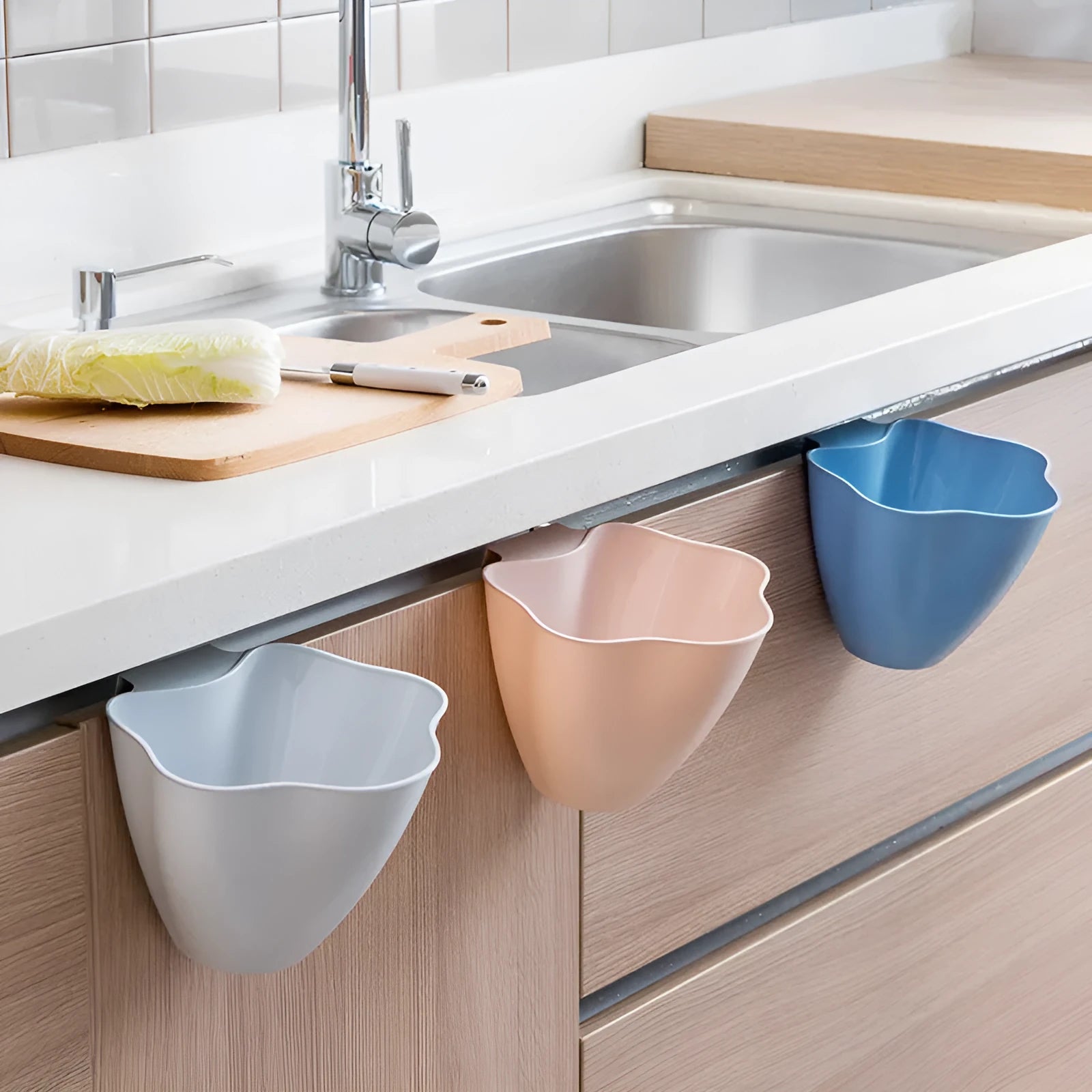 A slim Nordic blue plastic rubbish bin designed for kitchen cabinets.