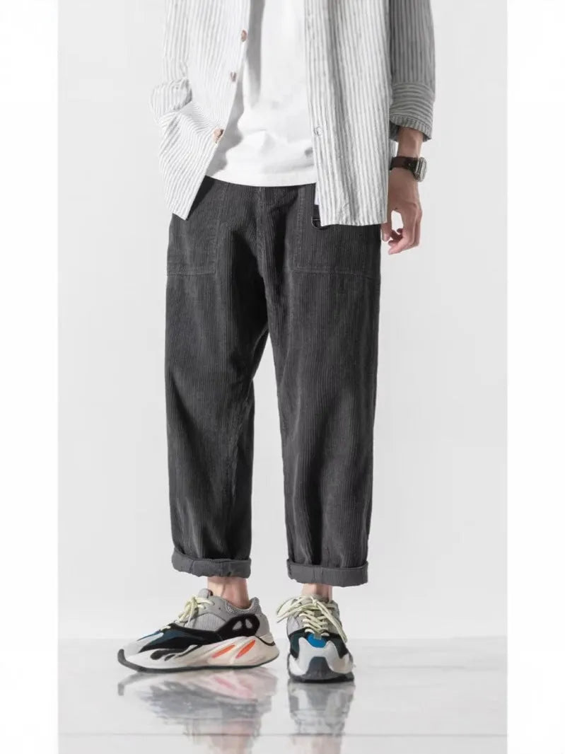 Loose straight tapered trousers with wide legs in dark grey, black, and khaki colours