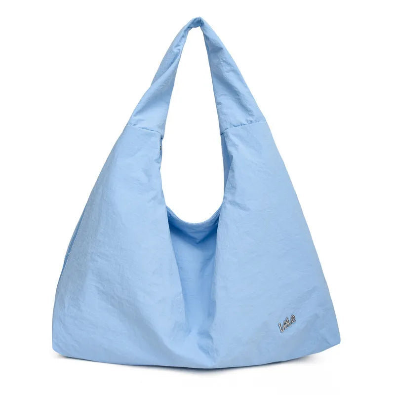 Women's heart-shaped nylon underarm bag in black, yellow, khaki, or blue colours showing large capacity design