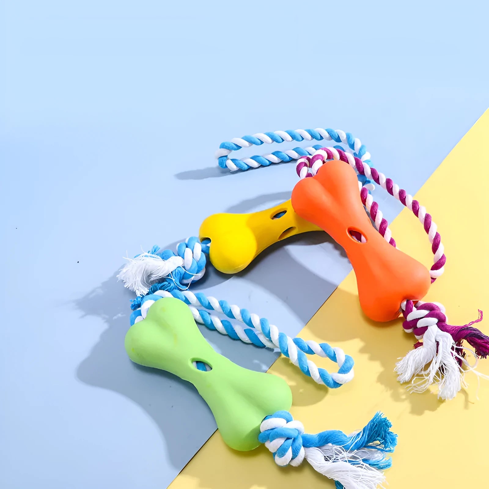 Green cotton rope bone-shaped dog chew toy with knot details and treat cavity