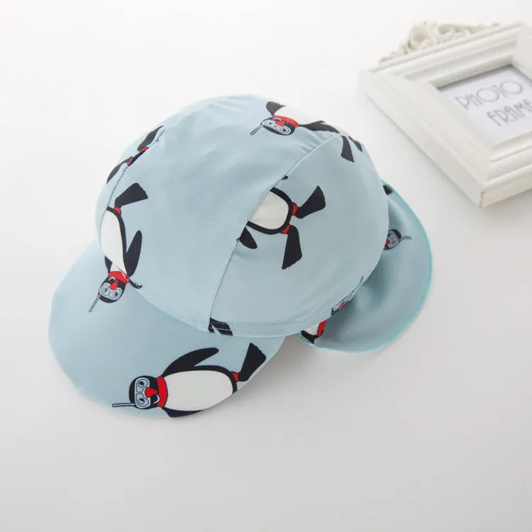 Boy's penguin print long sleeve one-piece swimsuit with matching swimming cap set
