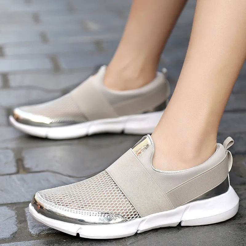 Blue, black, and grey low-cut women's casual sneakers with breathable mesh lining.