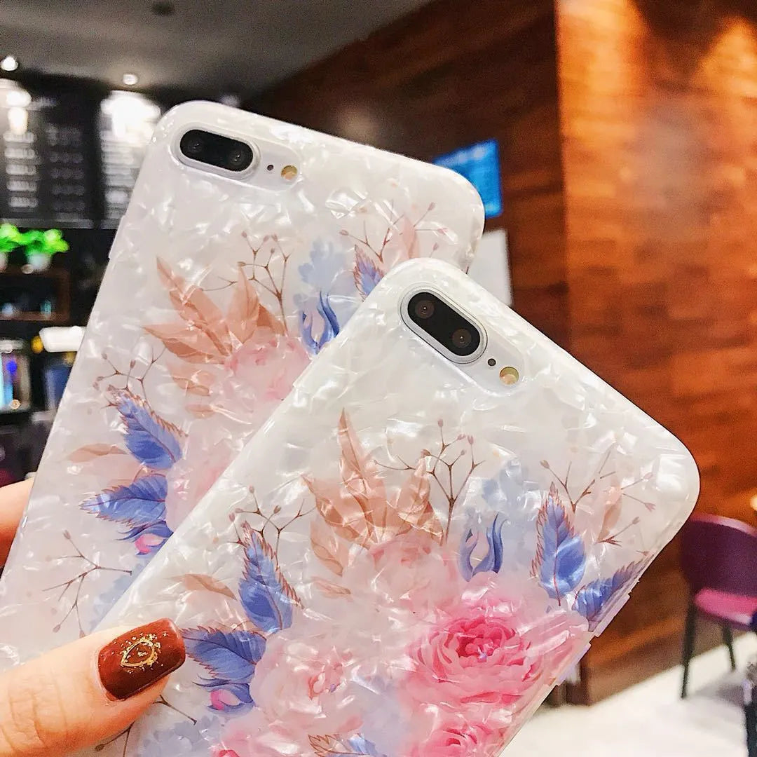 Dream Shell soft TPU silicone iPhone case with a rose flower design on the back, shown in brown colour.