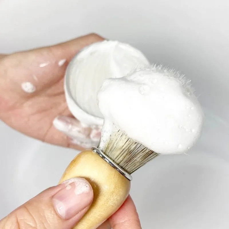 Mint scented shaving soap in aluminium box with rich foam on brush