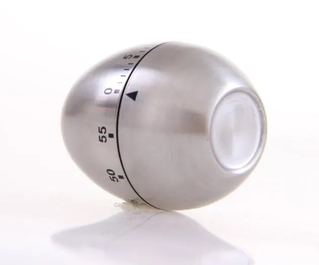 Stainless steel mechanical kitchen timer with egg-shaped design showing 60-minute dial