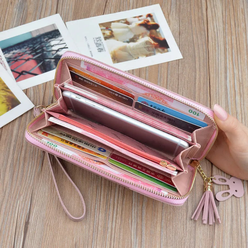 Women's horizontal square clutch bag with zipper, tassel, stitching, card slot, bill holder, in black, blue, or pink