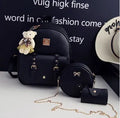 Women's 3-piece leather bag set showing backpack, shoulder bag, and card wallet with floral design