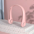 Pink bladeless neck fan being worn, showing USB charging port and control buttons.