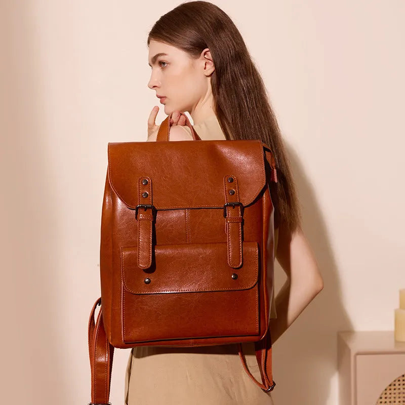 Women's leather computer backpack in black, brown, or coffee made from two-layer cowhide.