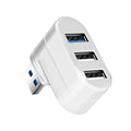 Black or white USB rotary splitter hub with four USB 3.0 ports on a desktop