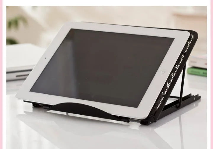 Silver folding laptop stand holding a laptop at an angle