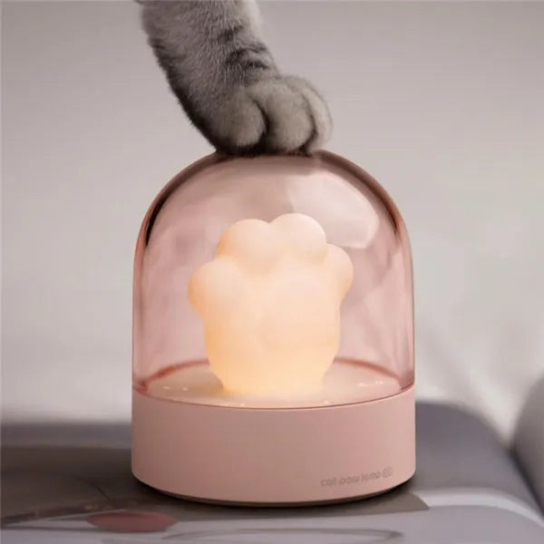 Pink cat paw shaped night light with USB charging cable and music box function