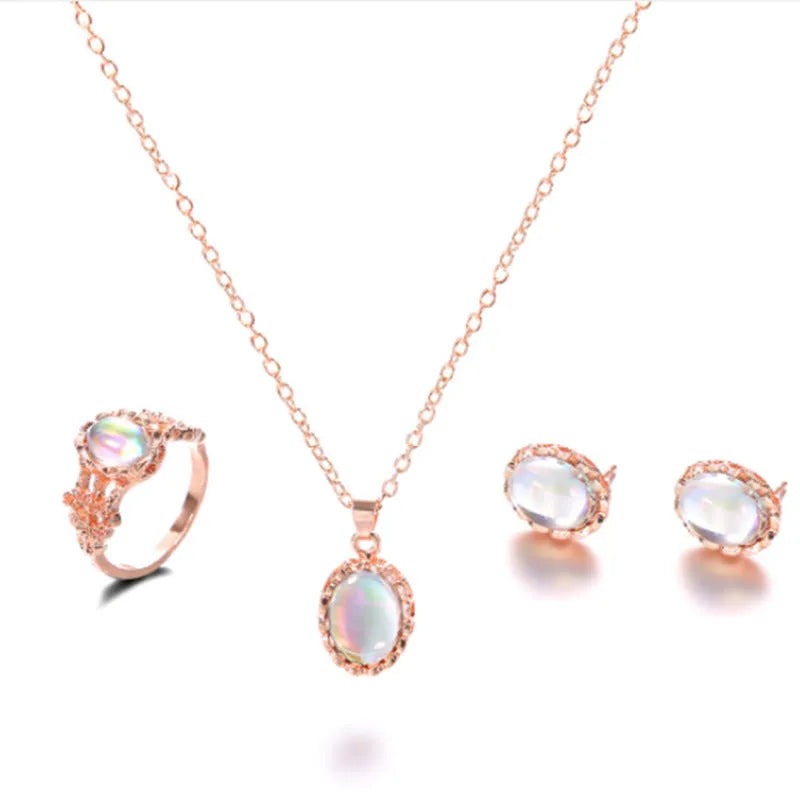 Women's pendant necklace set in alloy with electroplating and inlaid artificial gems, supplied with earrings and hand accessories.