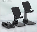 Standard desk mobile phone holder in silicone and ABS, shown in black, white, pink, and green colours