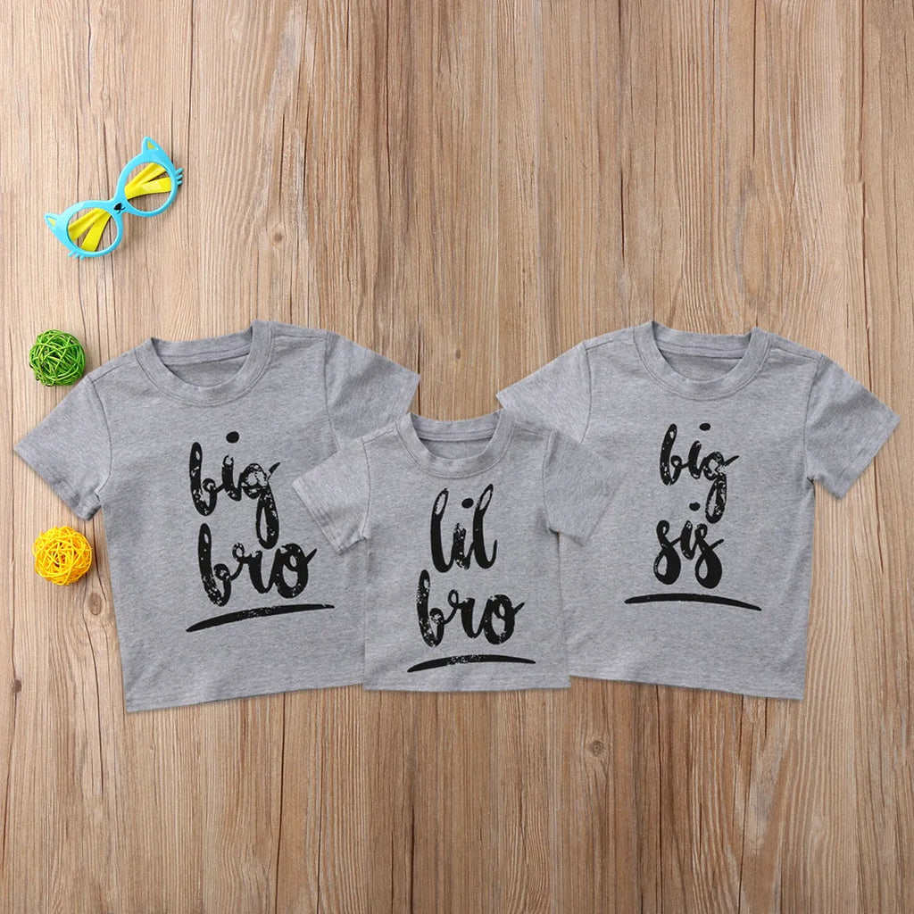 Grey printed cotton t-shirt showing sibling designs available in nine sizes from 60cm to 140cm
