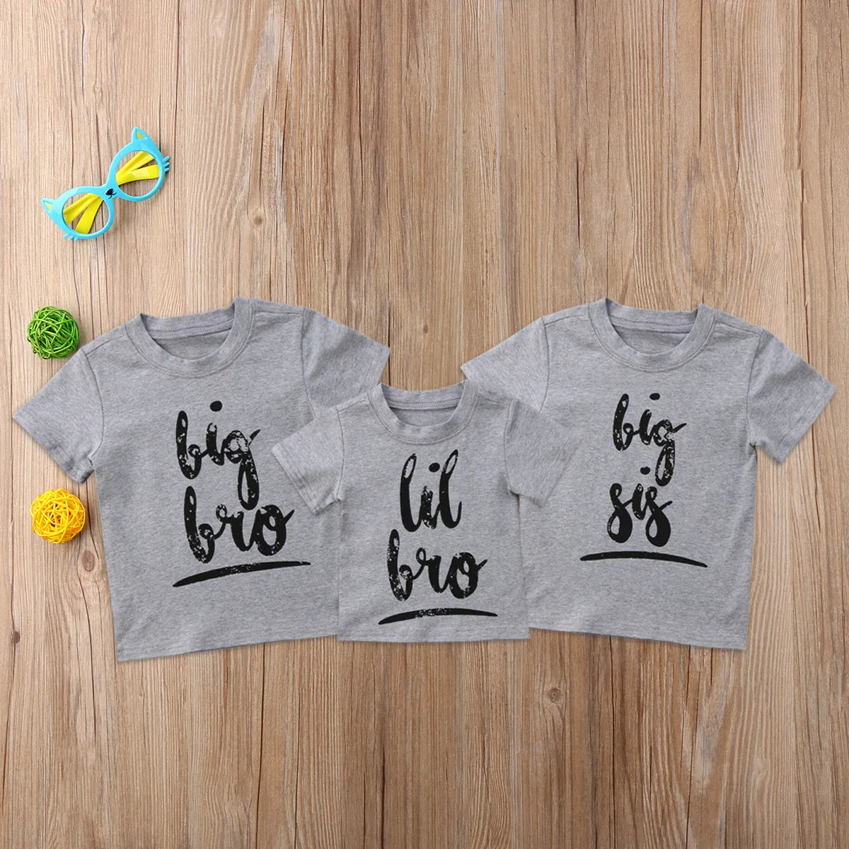 Grey printed cotton t-shirt showing sibling designs available in nine sizes from 60cm to 140cm