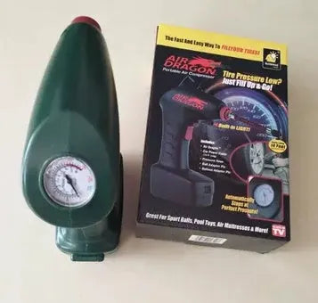 Compact black 12V portable car tyre pump with digital display, LED light, hose, and valve adapters on a grey background.