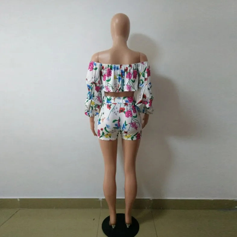 Multicolour digital print women's two-piece outfit with pile sleeve top and matching shorts.
