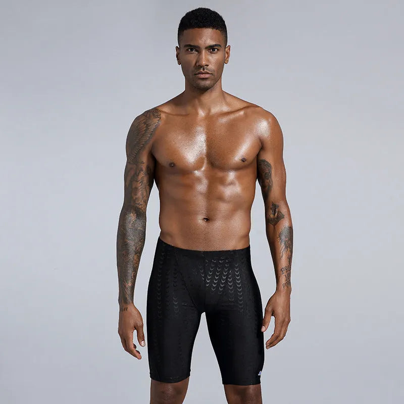 Men's solid colour waterproof polyester swimming trunks on a size chart showing XL, XXL, 3XL, 4XL.