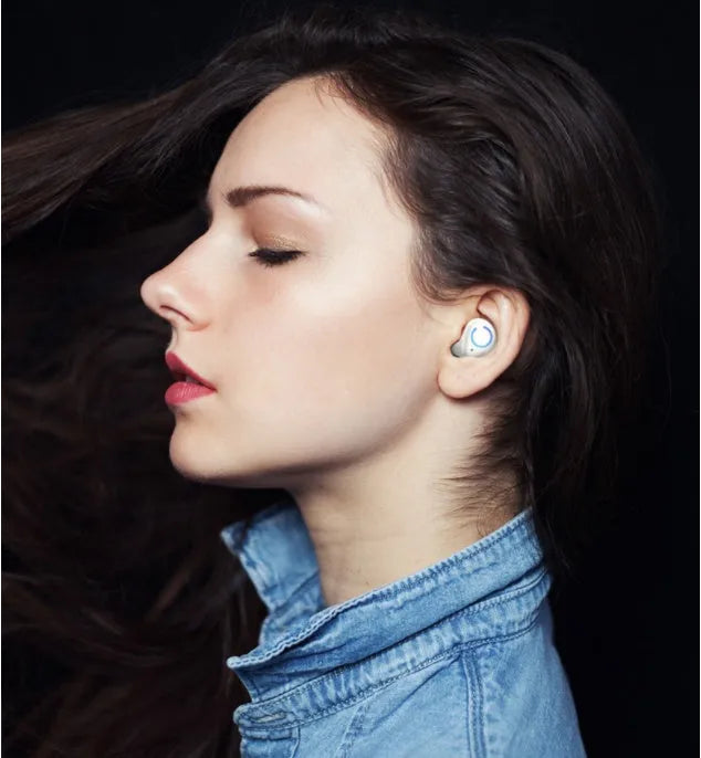 Black and white M18 true wireless Bluetooth in-ear headphones with charging case.