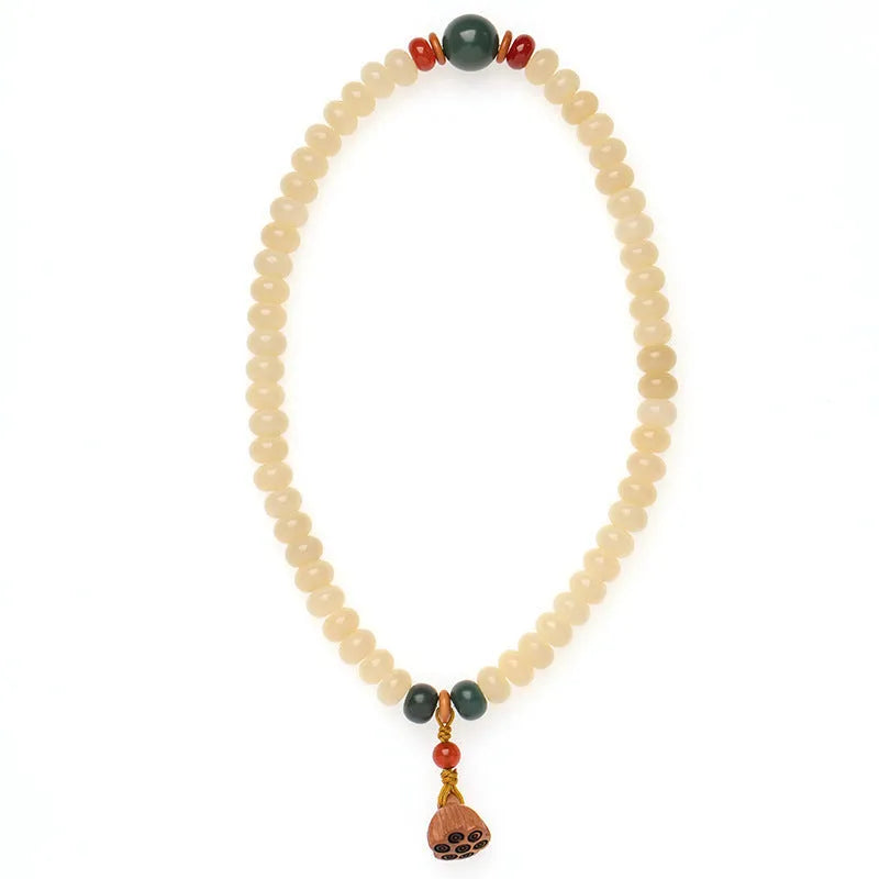 Wooden milk butter Bodhi root bracelet with 6x9mm flat round beads on wrist