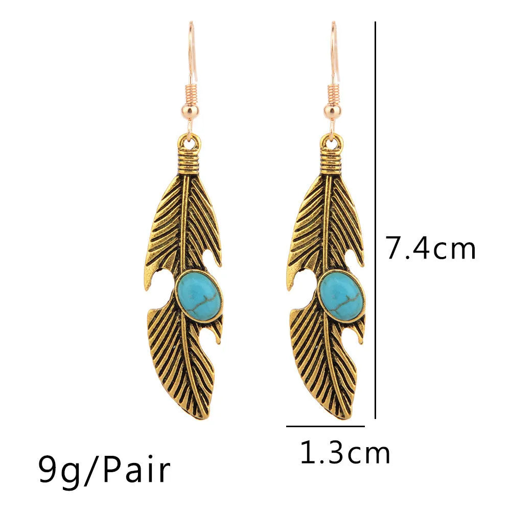 Vintage feather earrings with turquoise inlay leaf pattern in antique gold