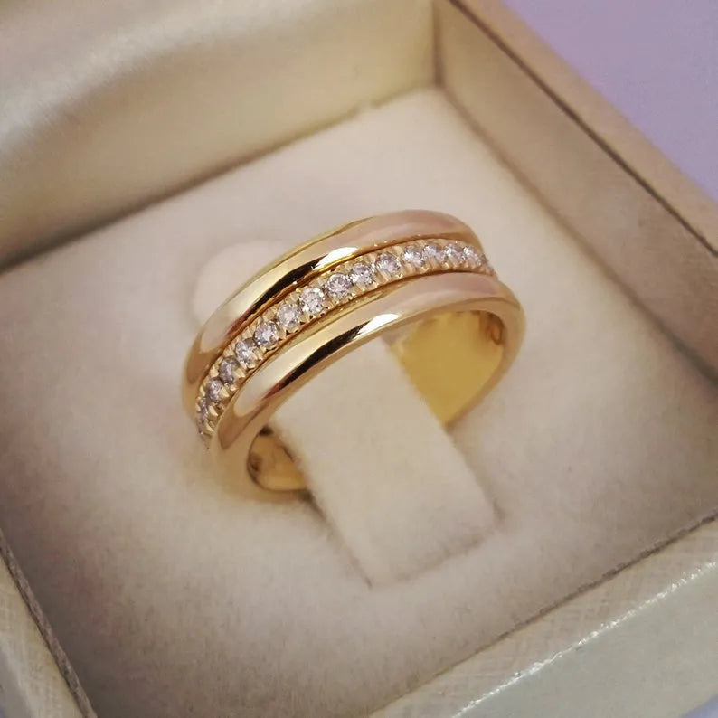 Gold plated geometric rhinestone ring with inlaid stone on white background, size options