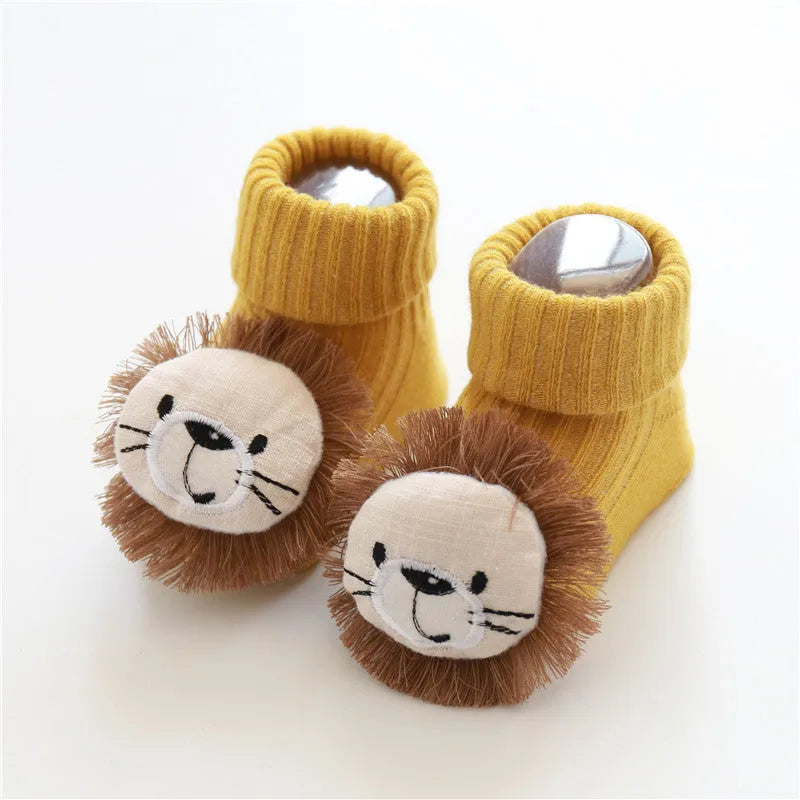 Cotton baby socks in multiple colours and designs including a panda pattern and a blue bow.
