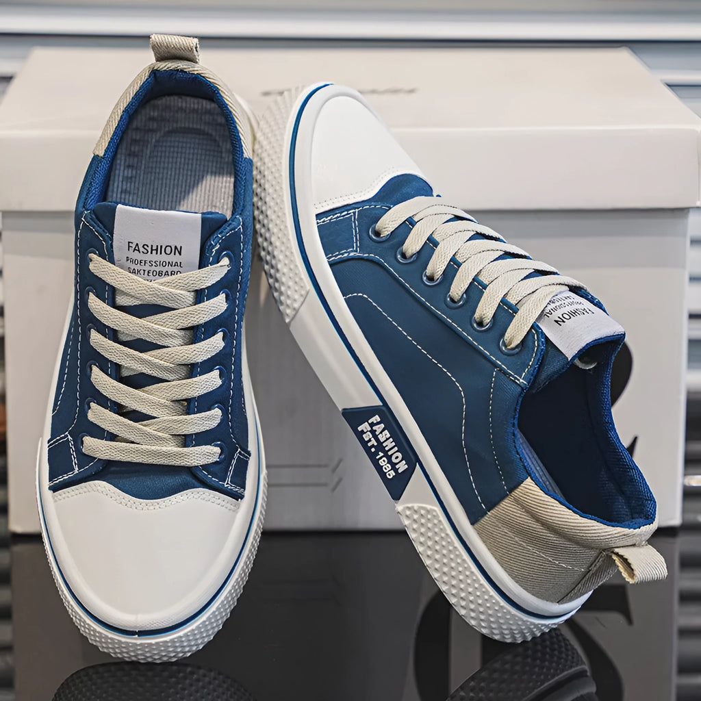 Men's low-top casual canvas skateboard shoes in blue with round toe and front lace-up closure.