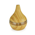 USB-powered mini air purifier humidifier in a wood grain columnar design for small rooms.