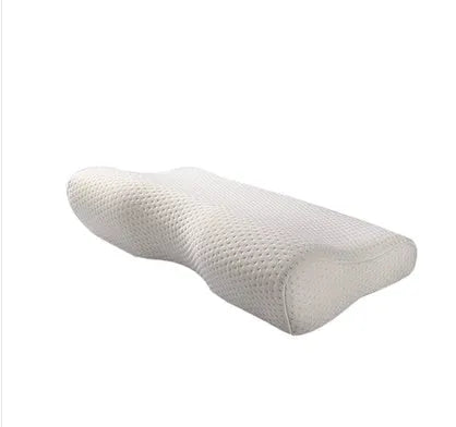 Blue butterfly-shaped memory foam cervical neck pillow on a bed