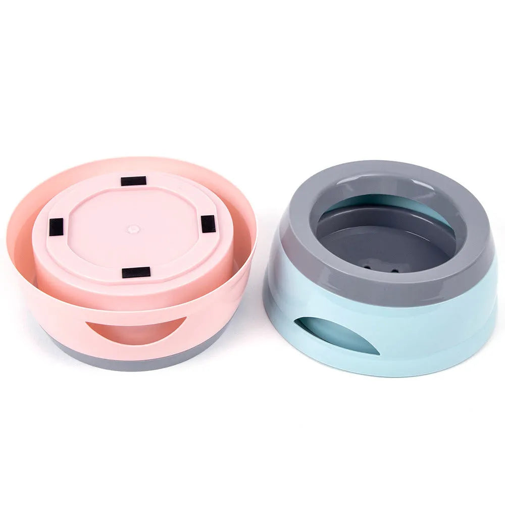 Floating no-spill pet bowl in ABS plastic, 15.3x18.9x8cm, shown in grey, green, pink or blue
