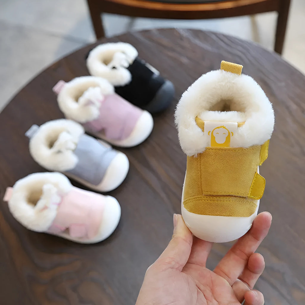 Children's velvet toddler shoes in various colours, showing non-slip sole and soft upper.