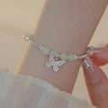 Hetian jade bracelet and necklace set for women with silver butterfly charms on electroplated copper chains