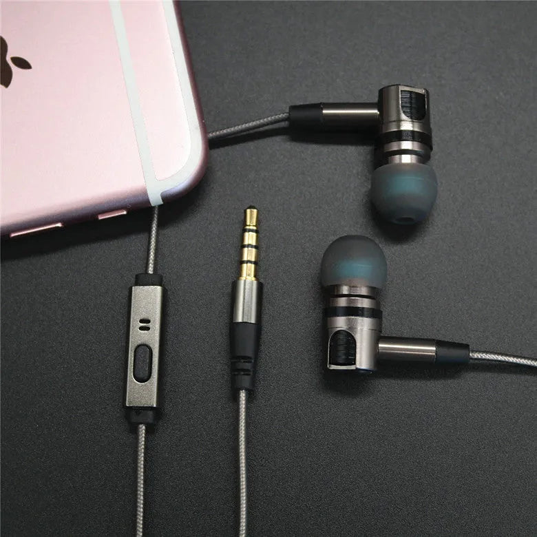 Titanium grey metal in-ear earphones with a detachable TPE cable and aluminium foil shielding.