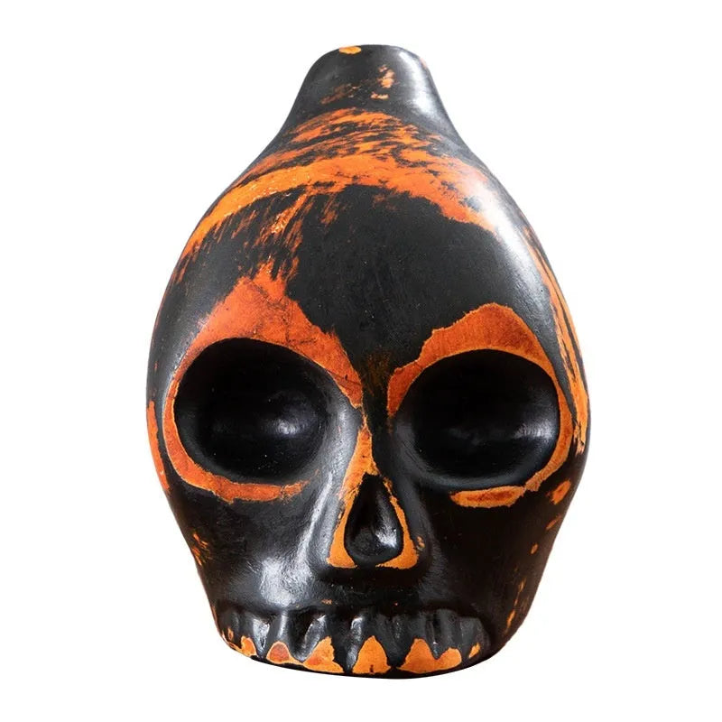 Skull whistle decompression toy in dolomite ceramic, shown in matte black and red and black colour options