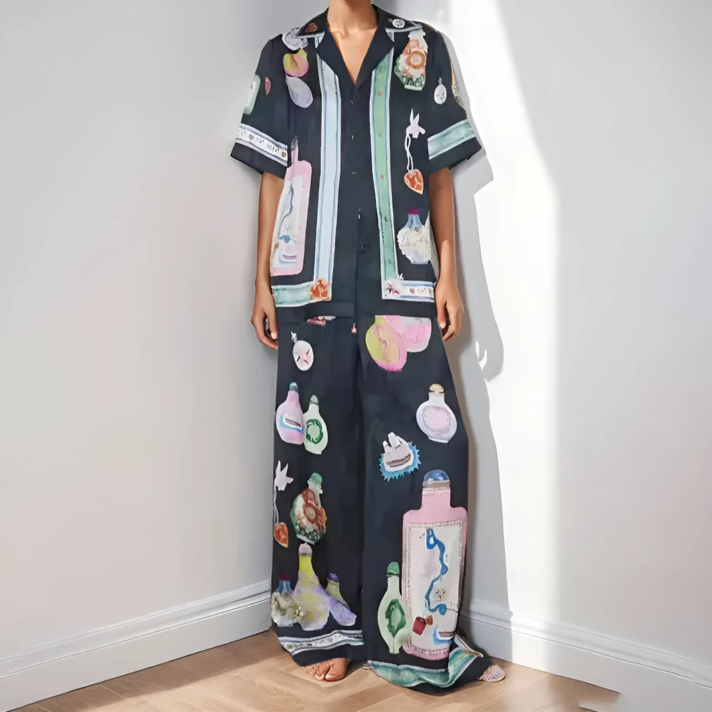 Black women's casual set with cartoon print, featuring a sleeve cardigan and trousers