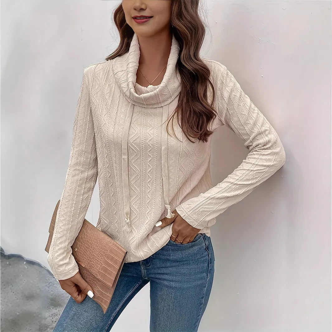 Apricot hooded pullover sweater with long sleeves on hanger