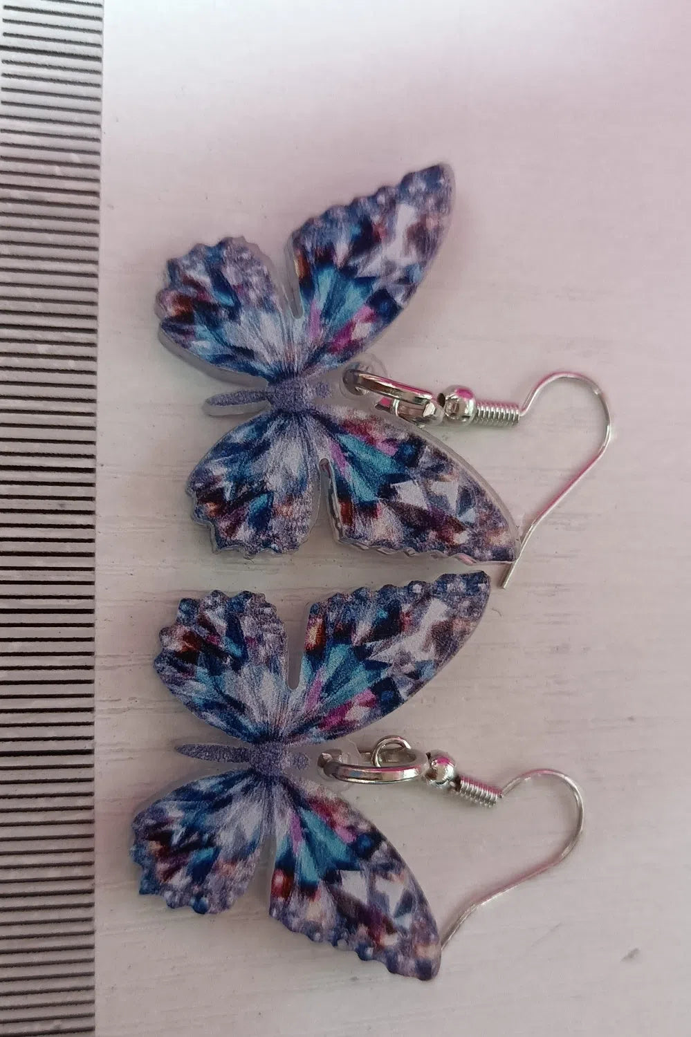 Colourful sparkling 2D acrylic earrings with butterfly design, mallard style finish, unisex