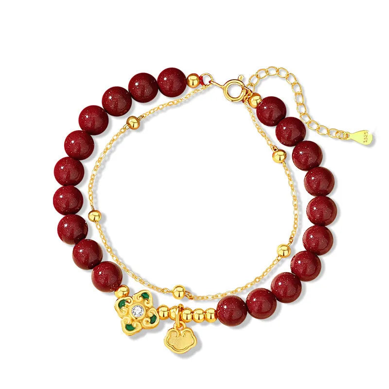 Sterling silver women's bracelet with Ruyi and Xiangyun motifs and cinnabar flower details