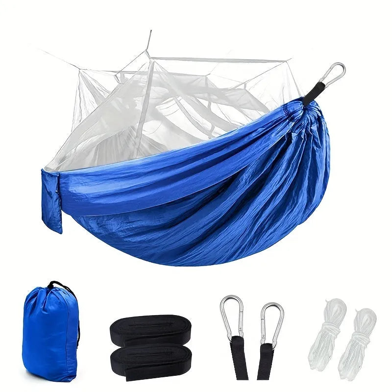 Portable double camping hammock with mosquito net and tree straps in outdoor setting