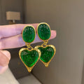 Pleated oval love heart stud earrings in alloy, showing purple, red, green, and yellow with white colour variations.
