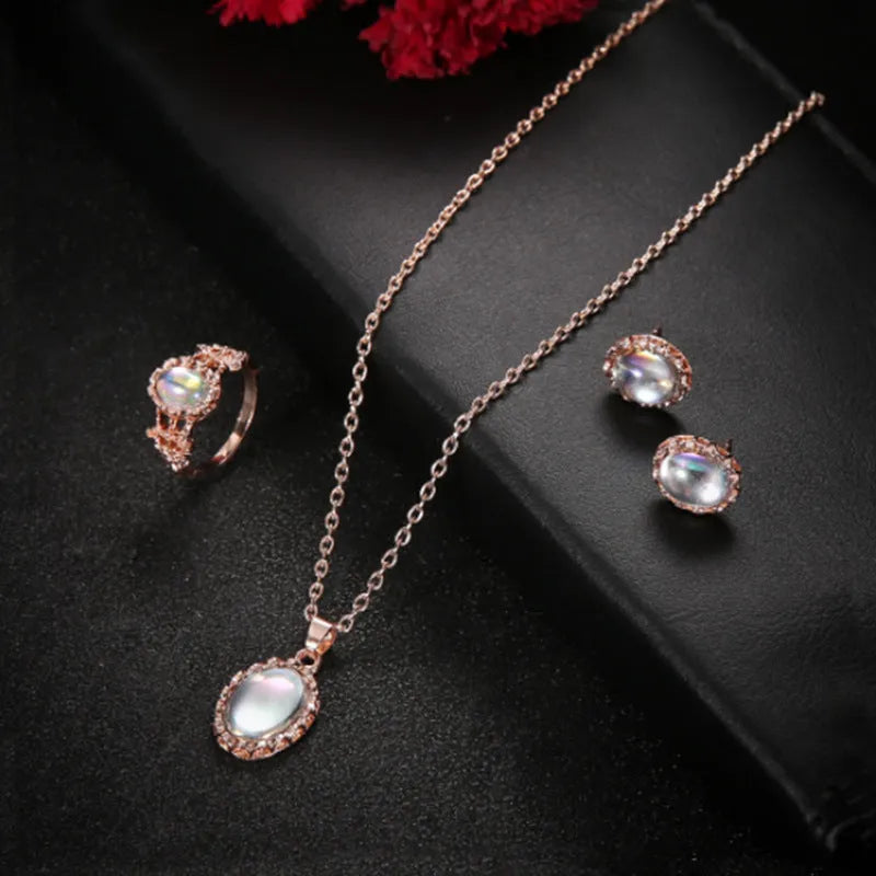 Women's pendant necklace set in alloy with electroplating and inlaid artificial gems, supplied with earrings and hand accessories.