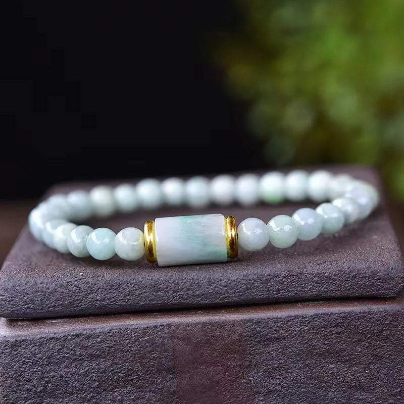 Myanmar Jade round bead bracelet in emerald green with geometric ethnic style design
