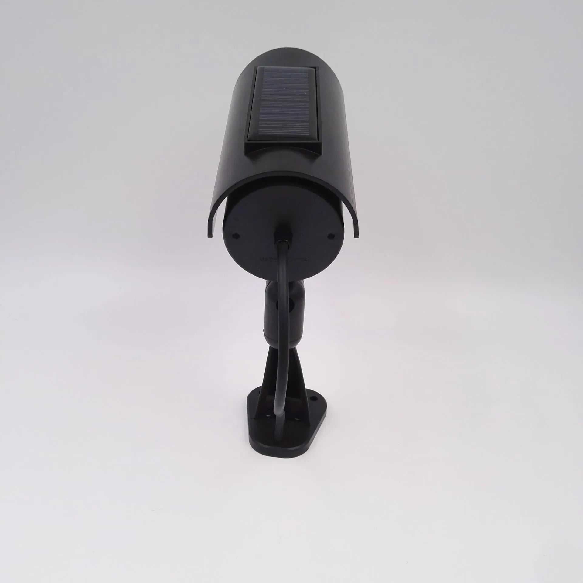 Black plastic fake security camera with gun-style design and solar simulation LED light