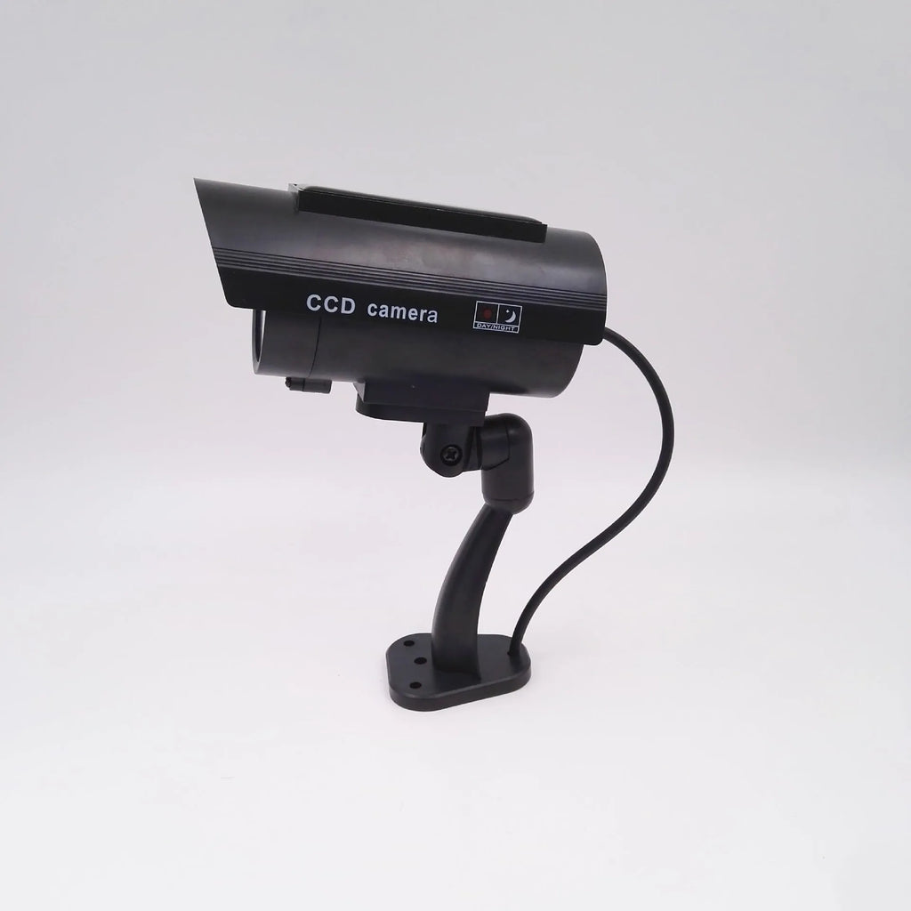 Black plastic fake security camera with gun-style design and solar simulation LED light
